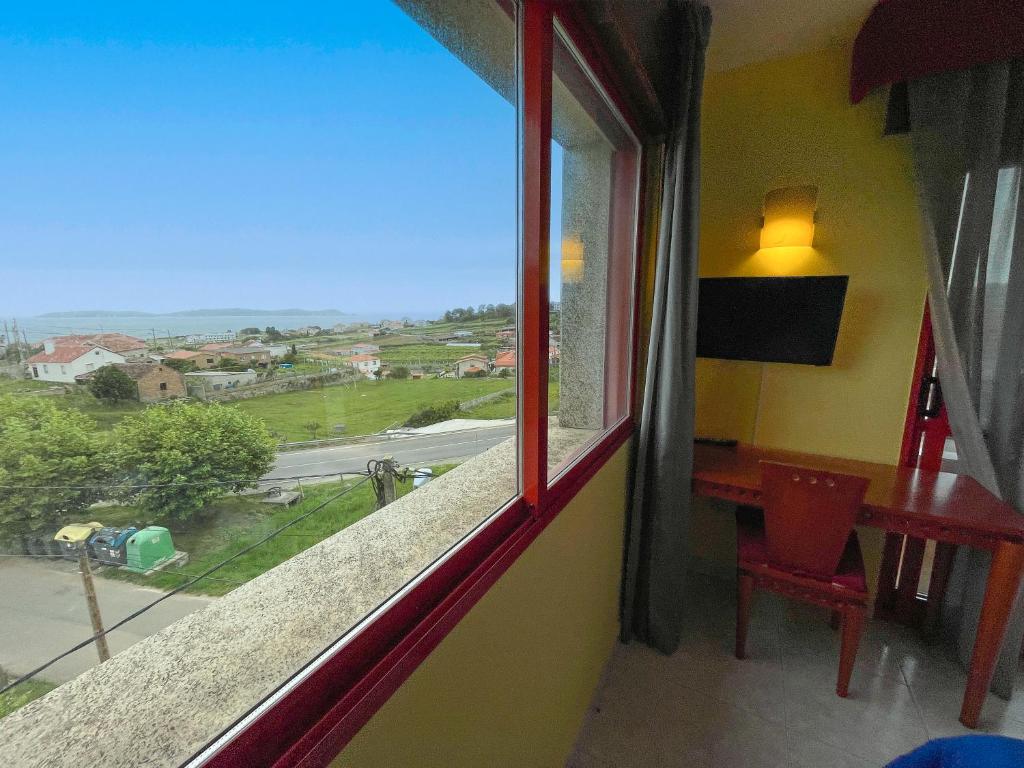 Televízia a/alebo spoločenská miestnosť v ubytovaní Hotel Acquamaris 3000