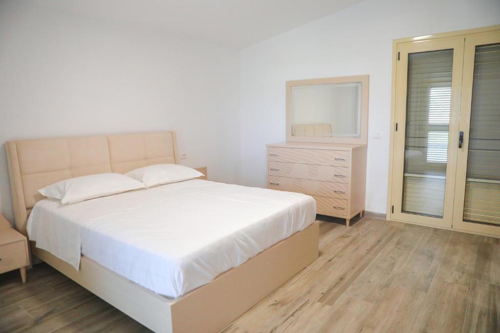 Postel nebo postele na pokoji v ubytování Amla's Villa