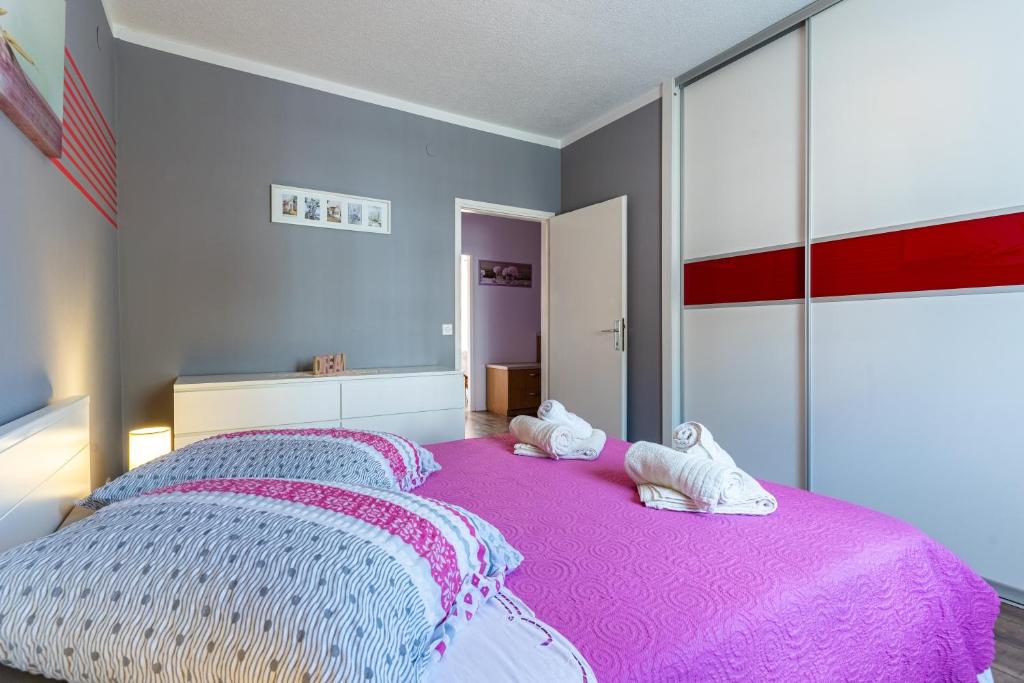 Postel nebo postele na pokoji v ubytování Apartman Laura