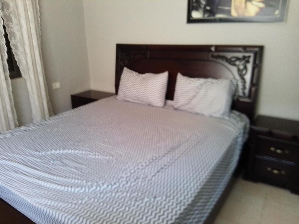 Postel nebo postele na pokoji v ubytování Ayola Apartment