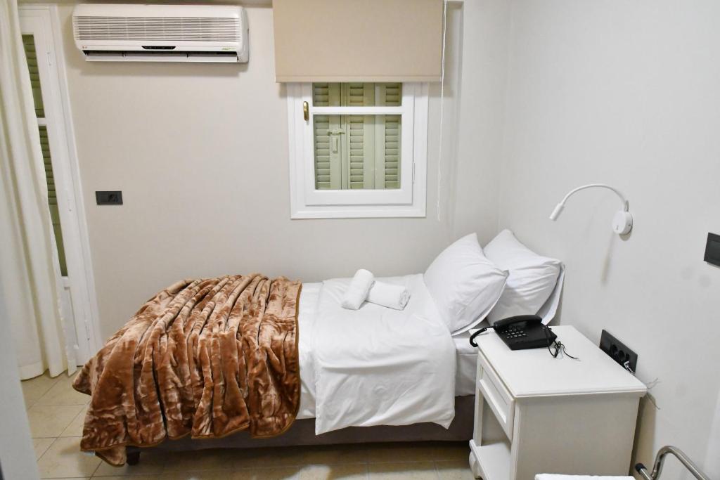 Postel nebo postele na pokoji v ubytování Porto Nafplio