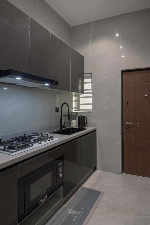 Kuchyň nebo kuchyňský kout v ubytování One90 Apartment