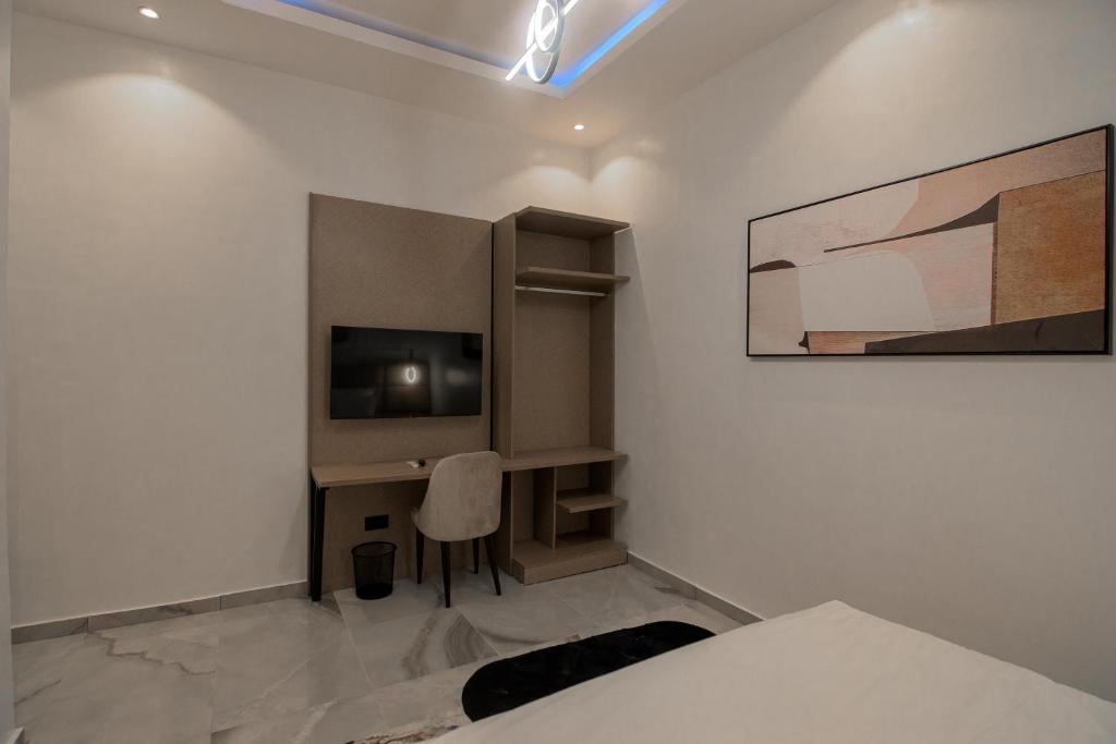 TV a/nebo společenská místnost v ubytování One90 Apartment