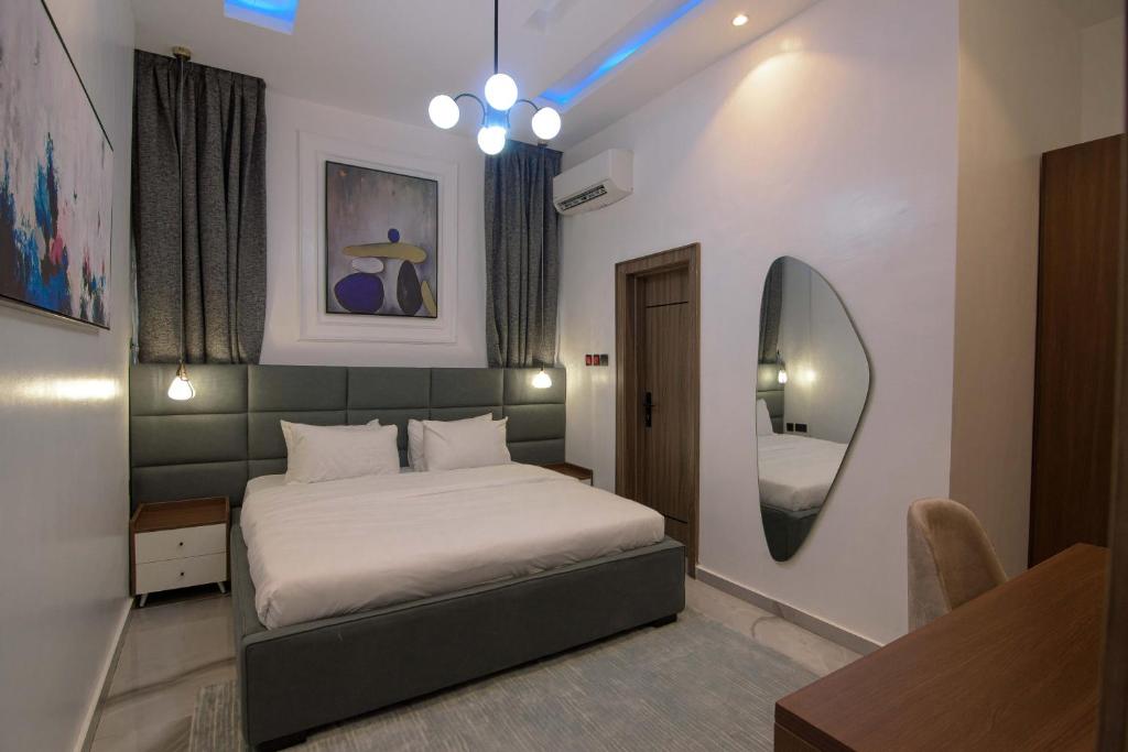 Postel nebo postele na pokoji v ubytování One90 Apartment