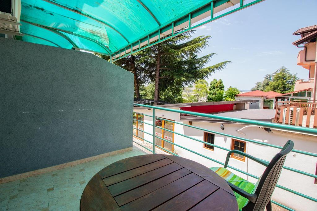 Balcony with wooden furniture