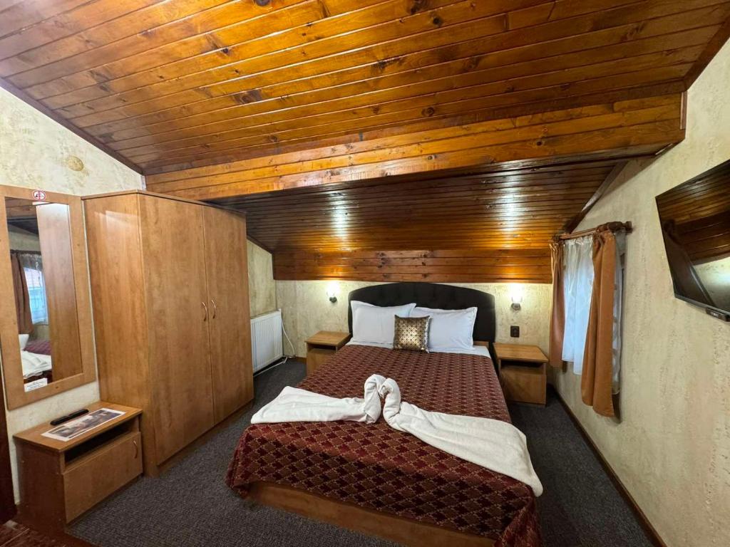 Postel nebo postele na pokoji v ubytování Guest House Ivan