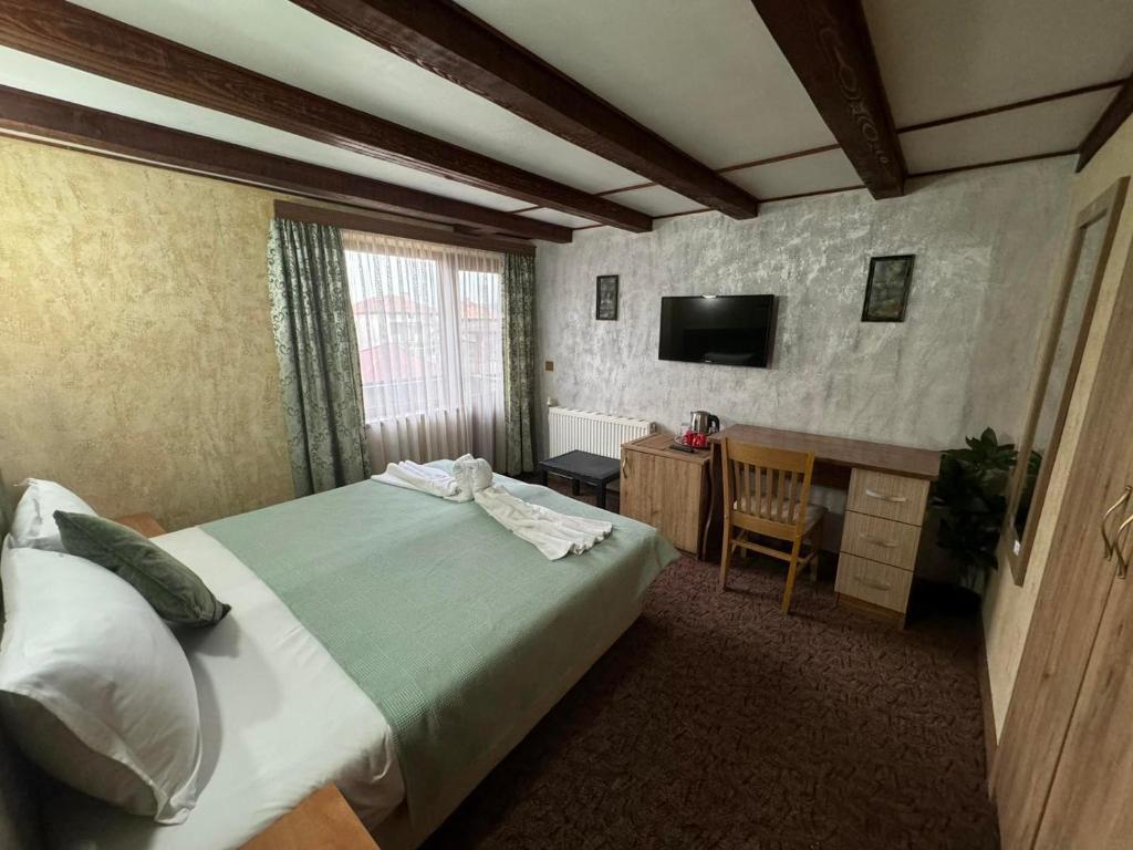 Postel nebo postele na pokoji v ubytování Guest House Ivan