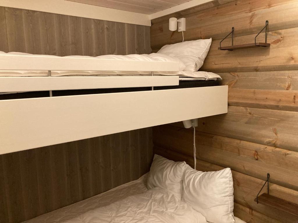 Postel nebo postele na pokoji v ubytování Björnrike Fjällstuga