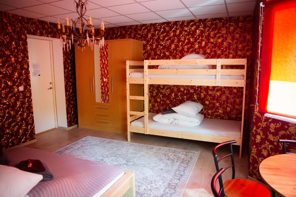 Postel nebo postele na pokoji v ubytování Konrad Family Guesthouse