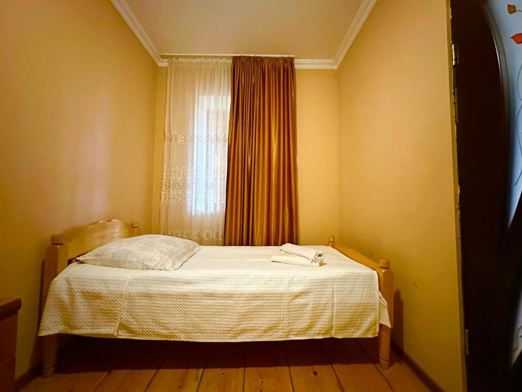 Postel nebo postele na pokoji v ubytování Mziuri Guest House