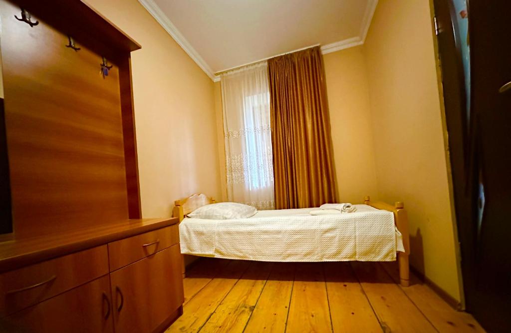 Postel nebo postele na pokoji v ubytování Mziuri Guest House