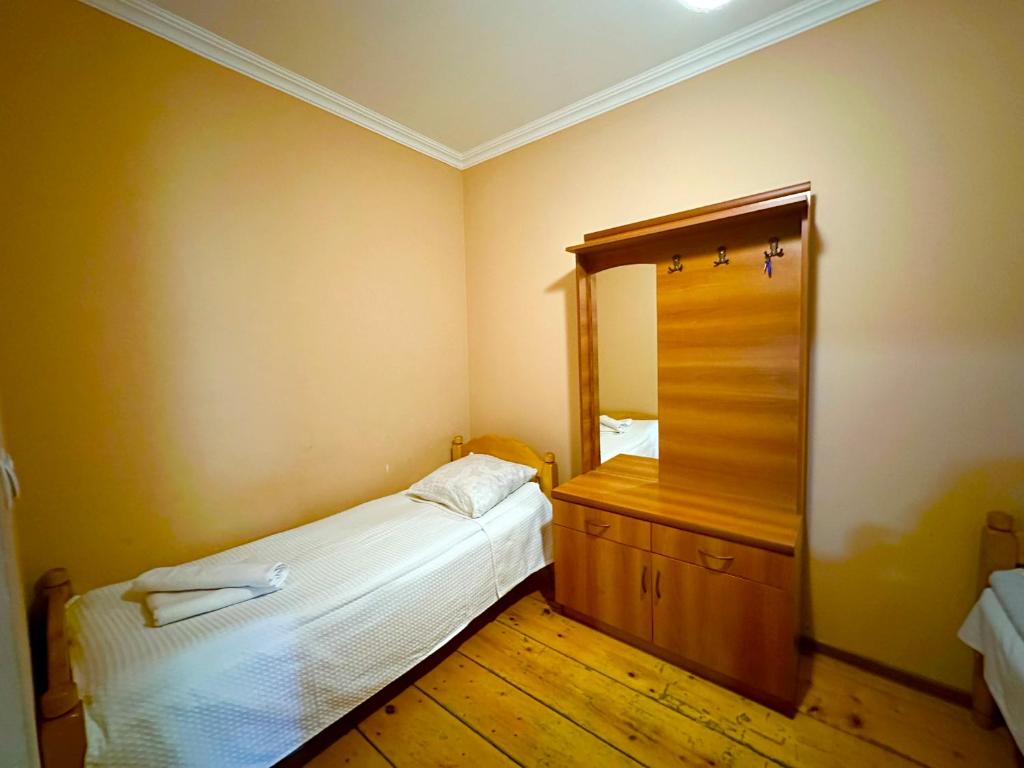 Postel nebo postele na pokoji v ubytování Mziuri Guest House