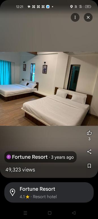 Postel nebo postele na pokoji v ubytování Fortune Resort