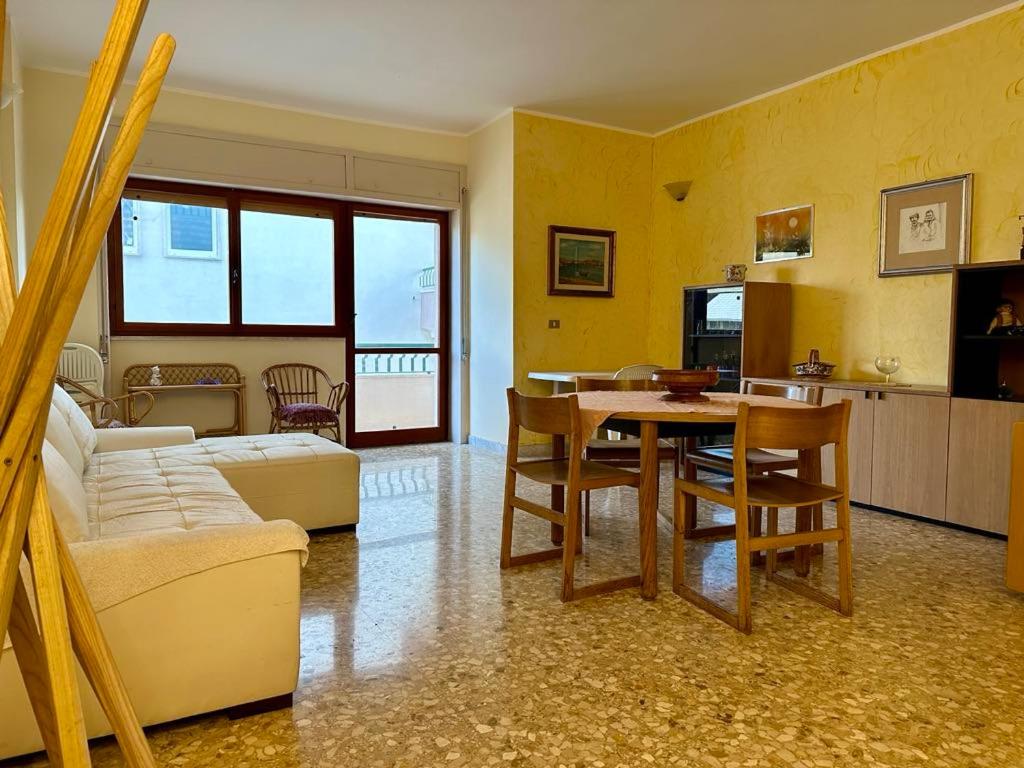 a living room with a couch and a table at Sea View Apartment in Gallipoli