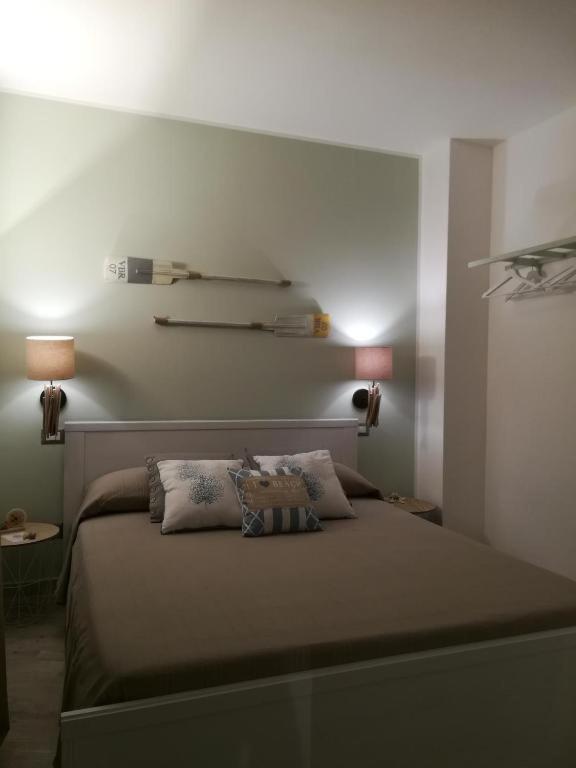 a bedroom with a bed with two pillows on it at Dimore di Mare in San Pietro Vernotico