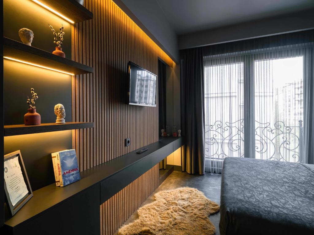 TV a/nebo společenská místnost v ubytování SennaCity Hotel