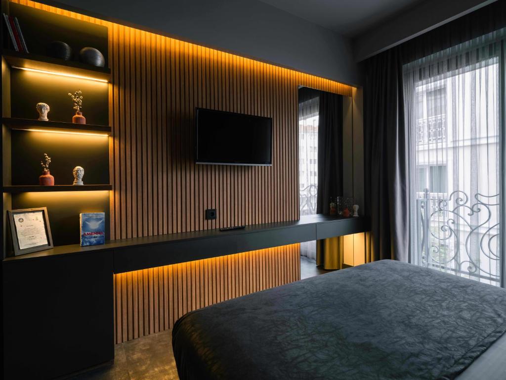 TV a/nebo společenská místnost v ubytování SennaCity Hotel