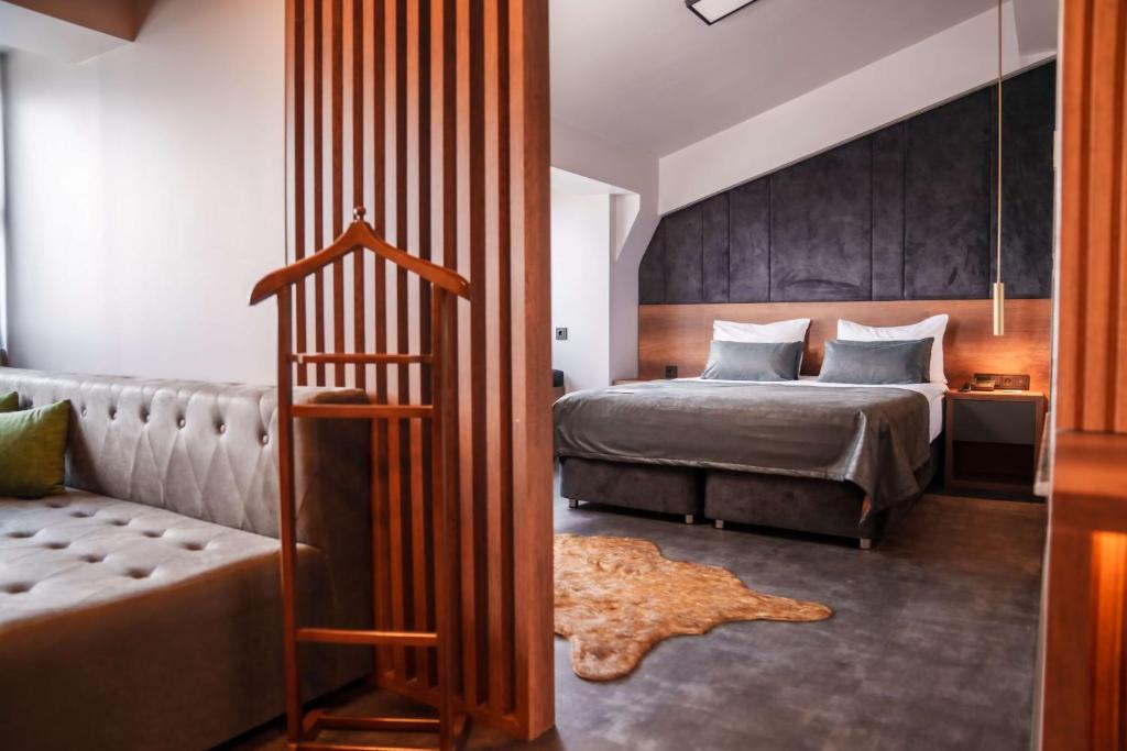 Postel nebo postele na pokoji v ubytování SennaCity Hotel