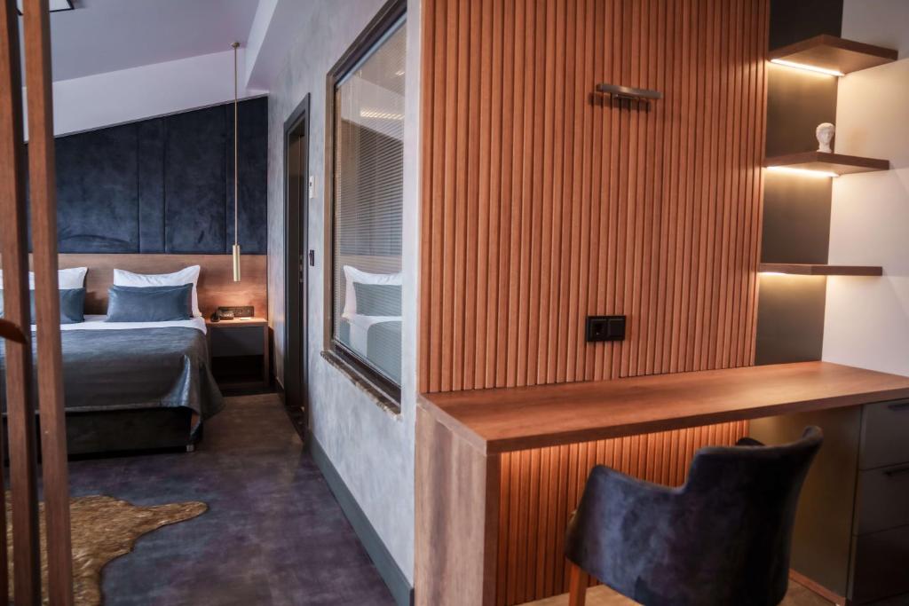 Postel nebo postele na pokoji v ubytování SennaCity Hotel