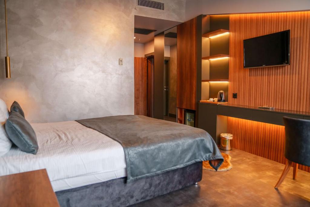 Postel nebo postele na pokoji v ubytování SennaCity Hotel