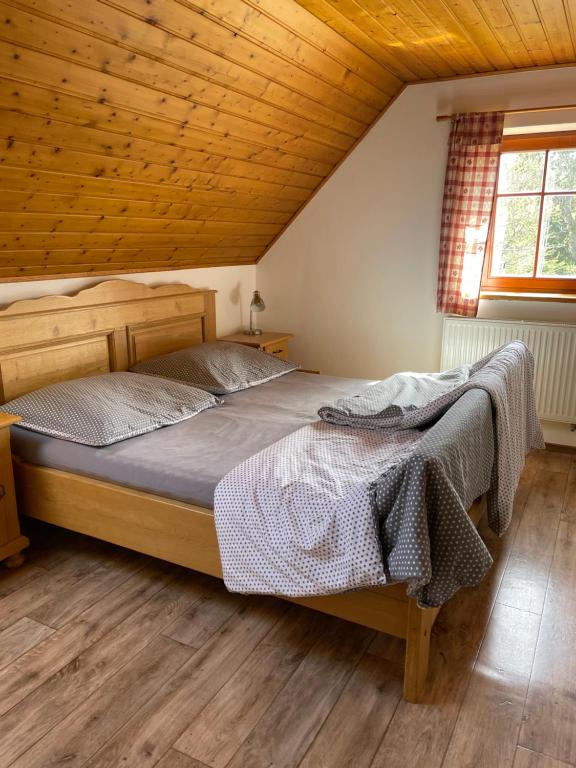 Postel nebo postele na pokoji v ubytování Chalupa Sněženka