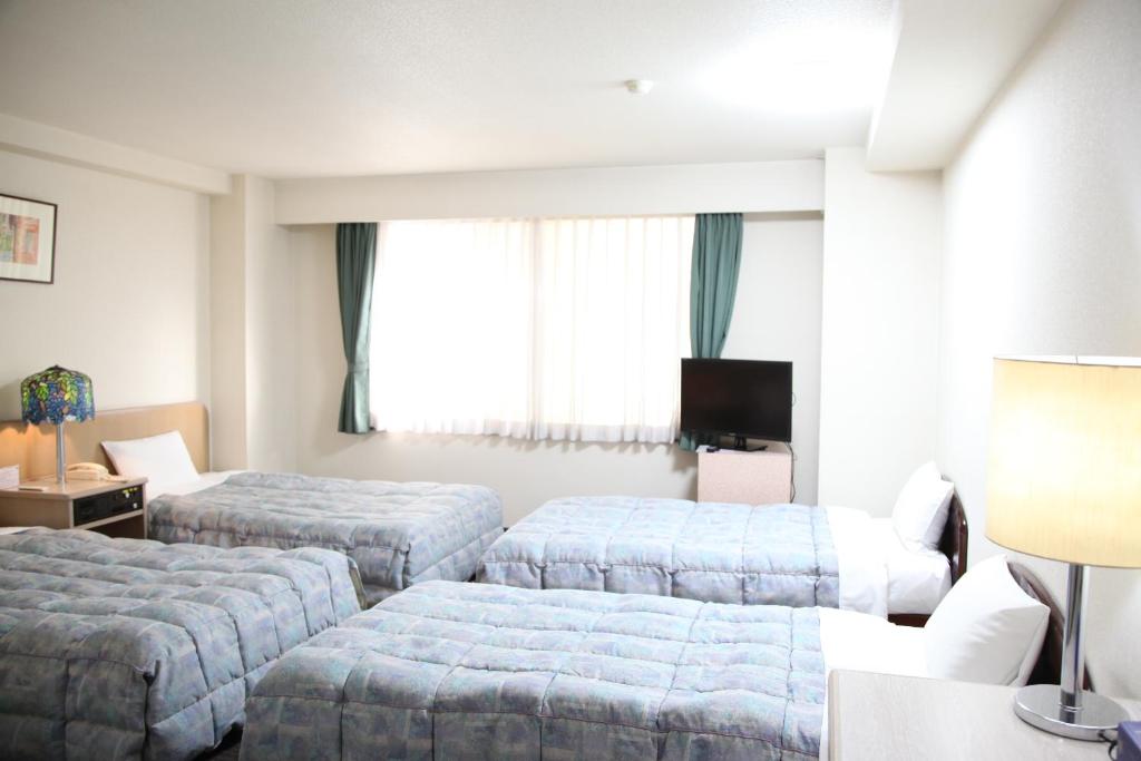 Postel nebo postele na pokoji v ubytování Hotel Luna Park