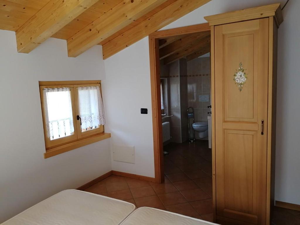 Postel nebo postele na pokoji v ubytování Locanda Castil