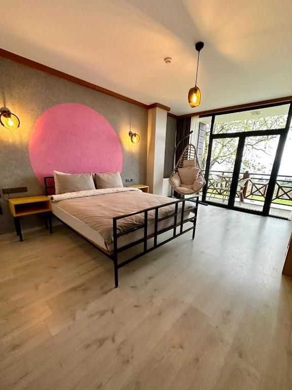A bed or beds in a room at İspendam Tess Otel