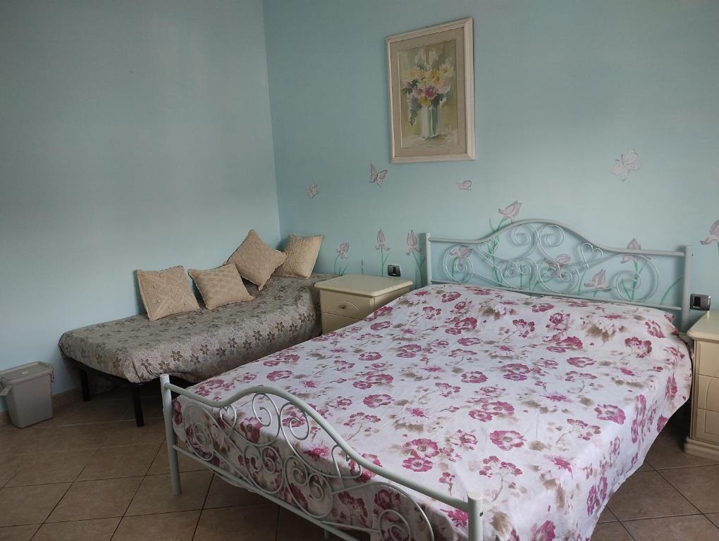 Postel nebo postele na pokoji v ubytování Fòndaco Scandicci