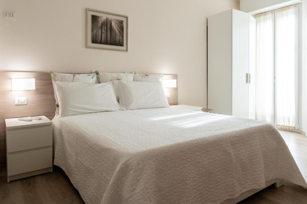 Postel nebo postele na pokoji v ubytování Cristel Apartment - 15 min da Milano