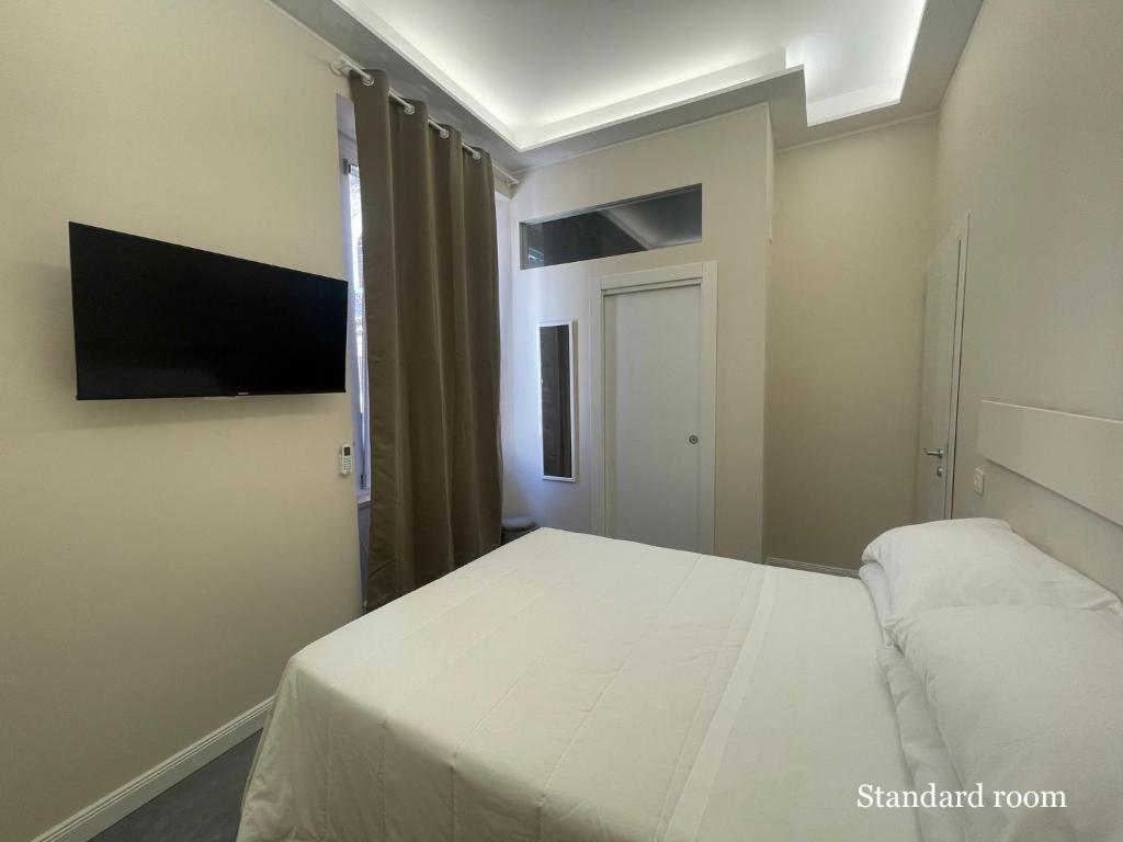 Postel nebo postele na pokoji v ubytování Le Cisterne Guest house Suite&Rooms