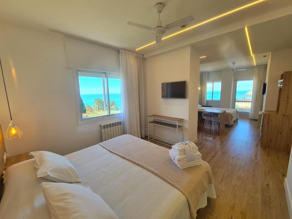 Postel nebo postele na pokoji v ubytování Hotel Mar Azul
