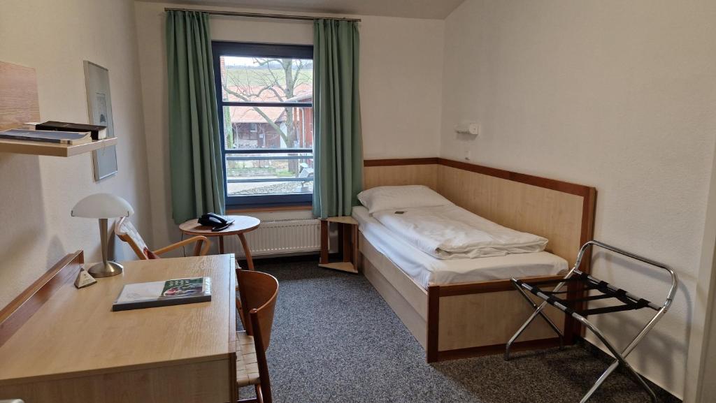 Postel nebo postele na pokoji v ubytování Kloster Drübeck