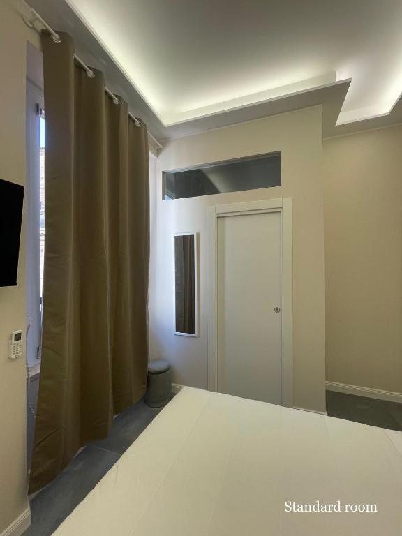 TV a/nebo společenská místnost v ubytování Le Cisterne Guest house Suite&Rooms