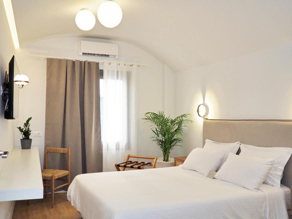 Posteľ alebo postele v izbe v ubytovaní Times Elegant Rooms