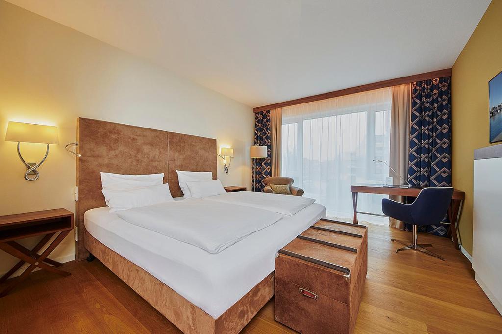 Postel nebo postele na pokoji v ubytování Hotel Hafenspeicher
