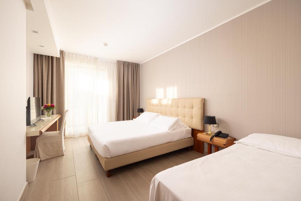 Postel nebo postele na pokoji v ubytování D'Aragona Lifestyle Hotel