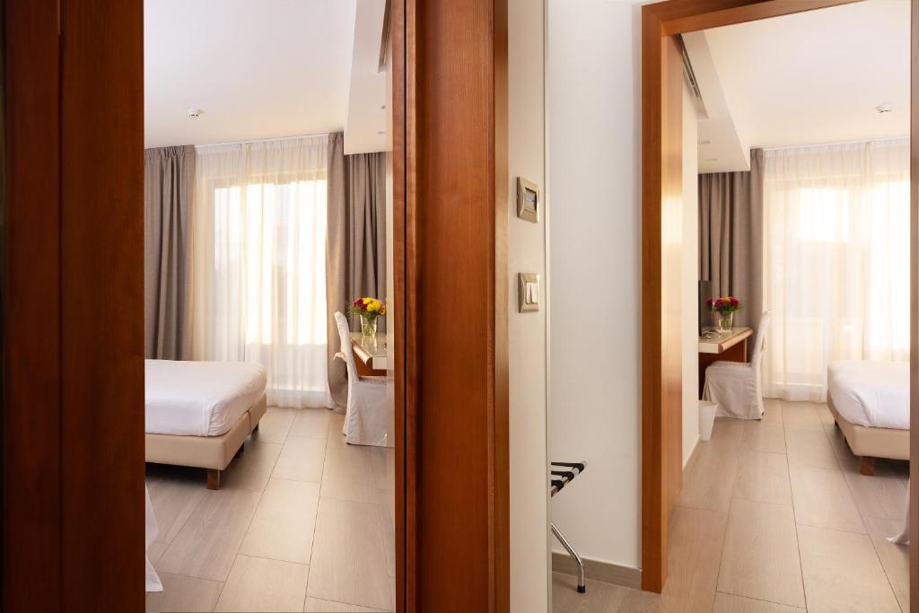 Postel nebo postele na pokoji v ubytování D'Aragona Lifestyle Hotel