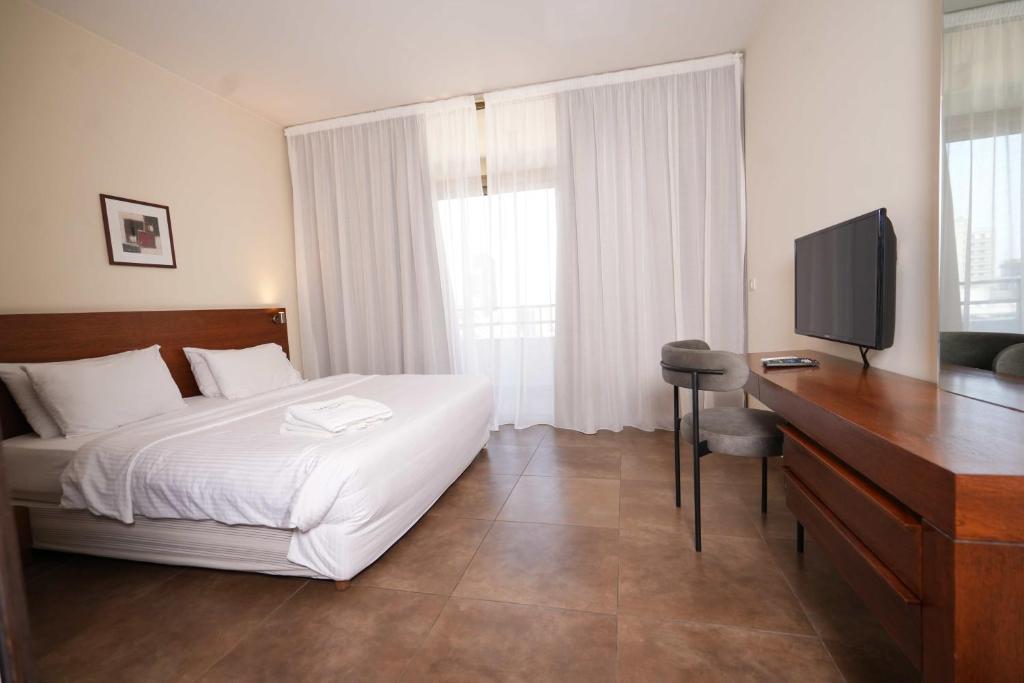 TV a/nebo společenská místnost v ubytování Santona Residence