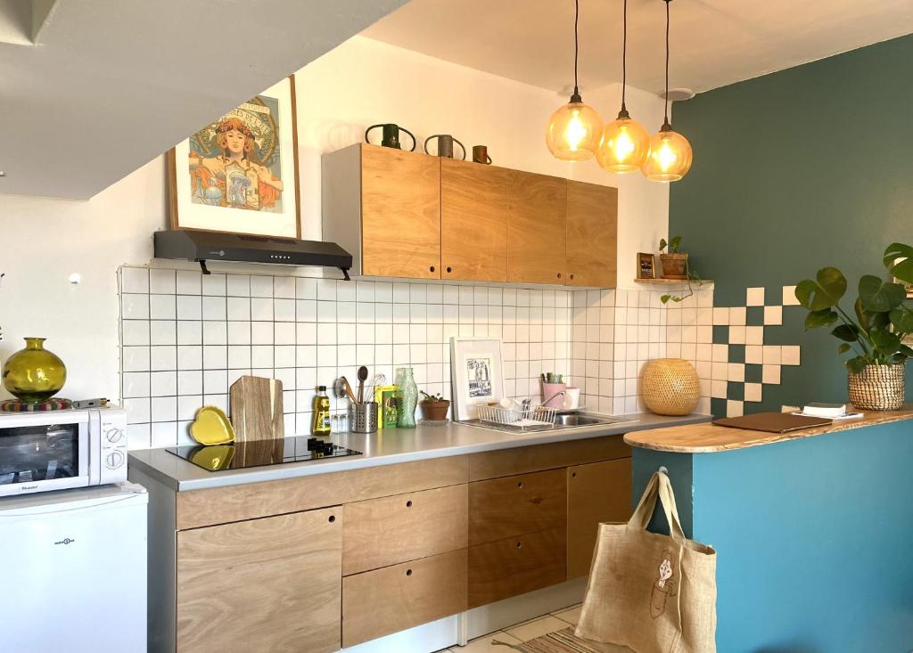 Køkken eller tekøkken på Les Toits wifi gratuit Vue cœur de ville historique et Halles