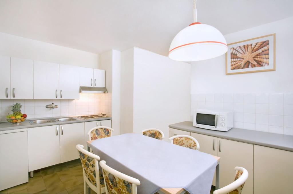 Kuchyň nebo kuchyňský kout v ubytování Lanterna Resort