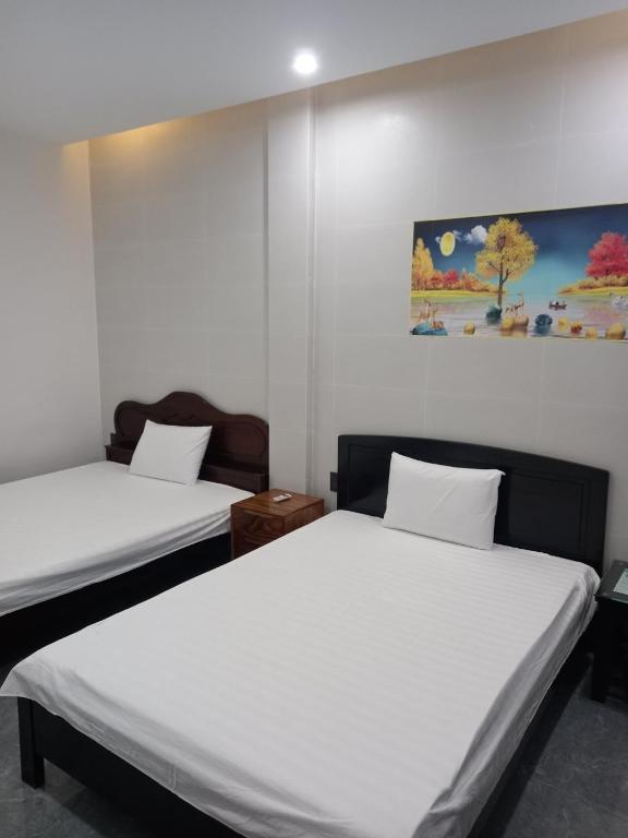 Postel nebo postele na pokoji v ubytování Hung Thinh Motel