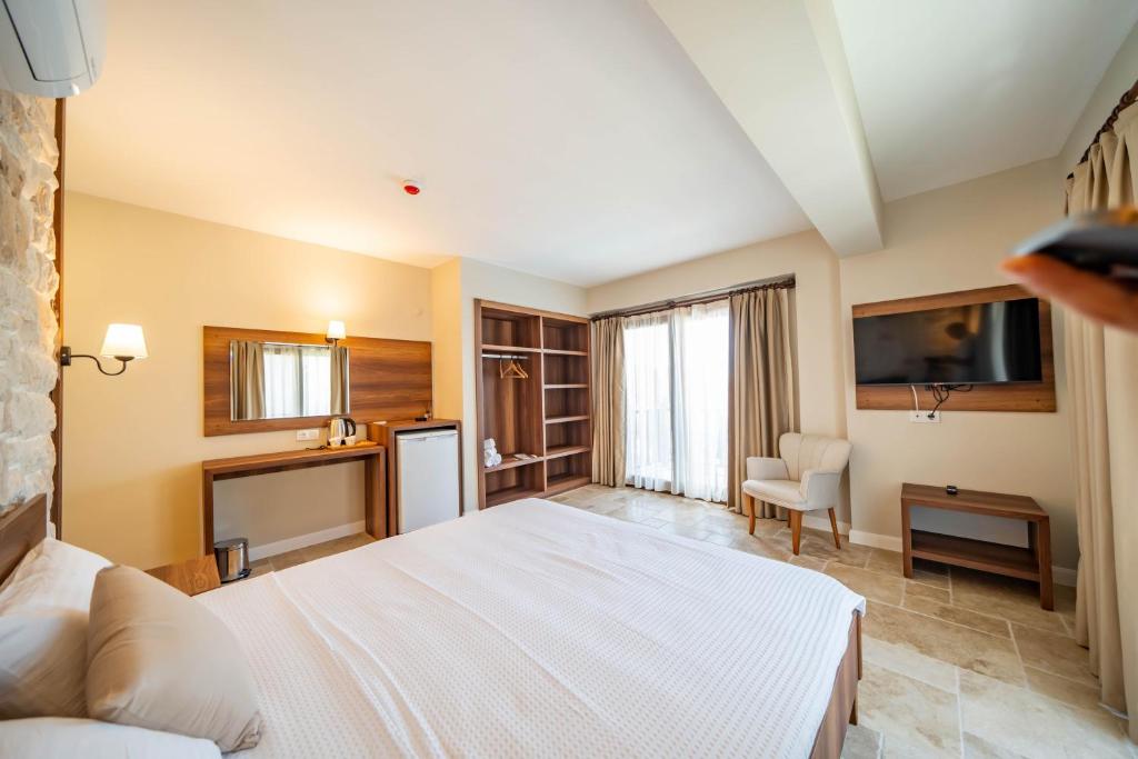 Postel nebo postele na pokoji v ubytování Selimiye Thales Otel