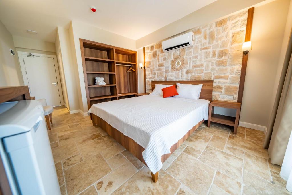 Postel nebo postele na pokoji v ubytování Selimiye Thales Otel