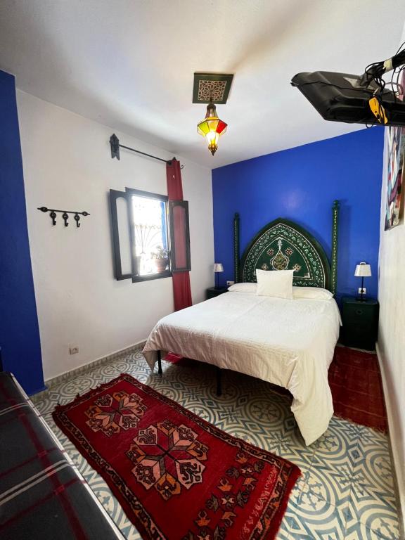 Postel nebo postele na pokoji v ubytování Riad Tassili Chaouen