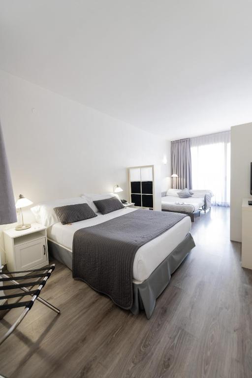 Posteľ alebo postele v izbe v ubytovaní Aparthotel Atenea Calabria