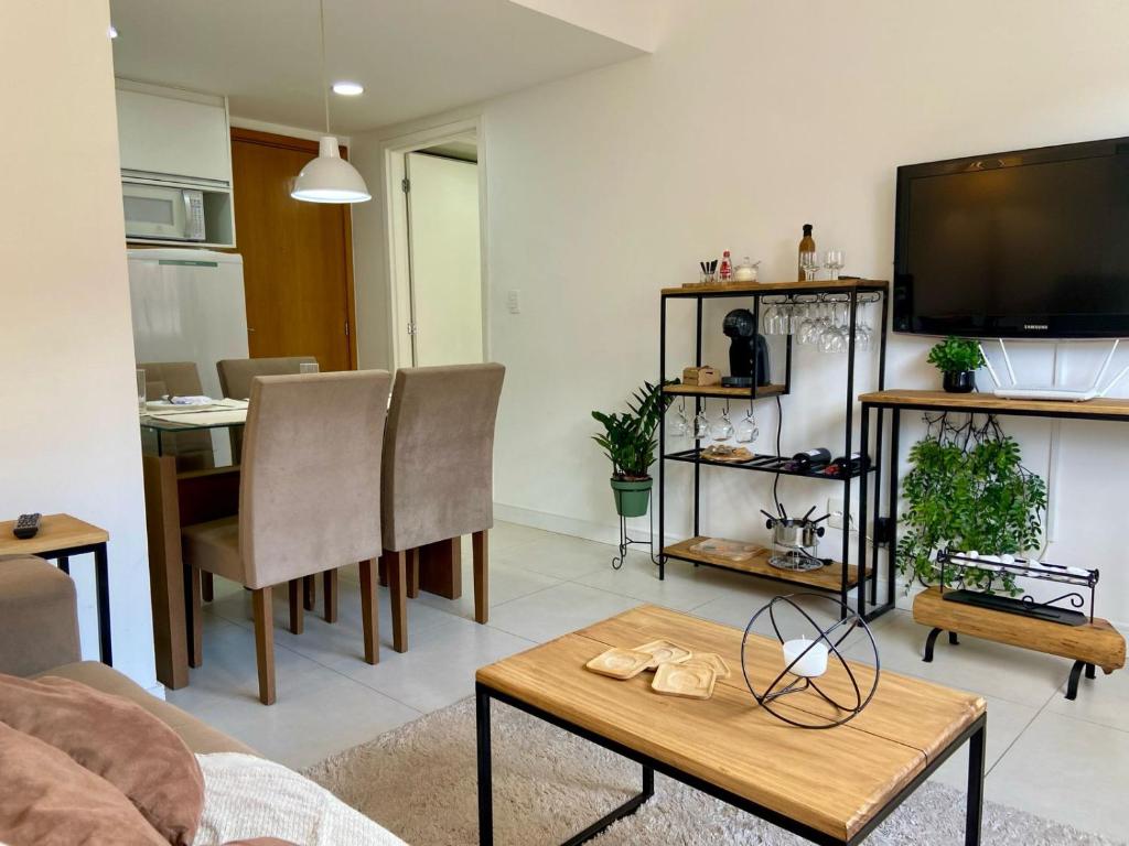 Televisyen dan/atau pusat hiburan di Refúgio da Serra - Conforto e tranquilidade com piscina e academia