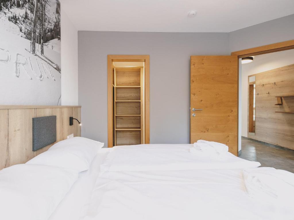 Posteľ alebo postele v izbe v ubytovaní First IN Mountain Chalets by we rent