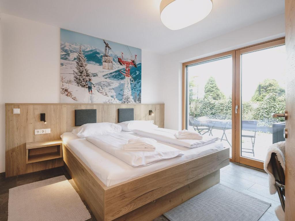 Posteľ alebo postele v izbe v ubytovaní First IN Mountain Chalets by we rent