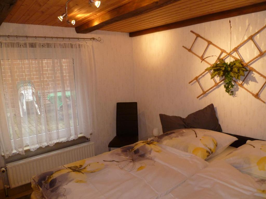 a bedroom with a bed with a star on the wall at Guest House Schneider in Laatzen